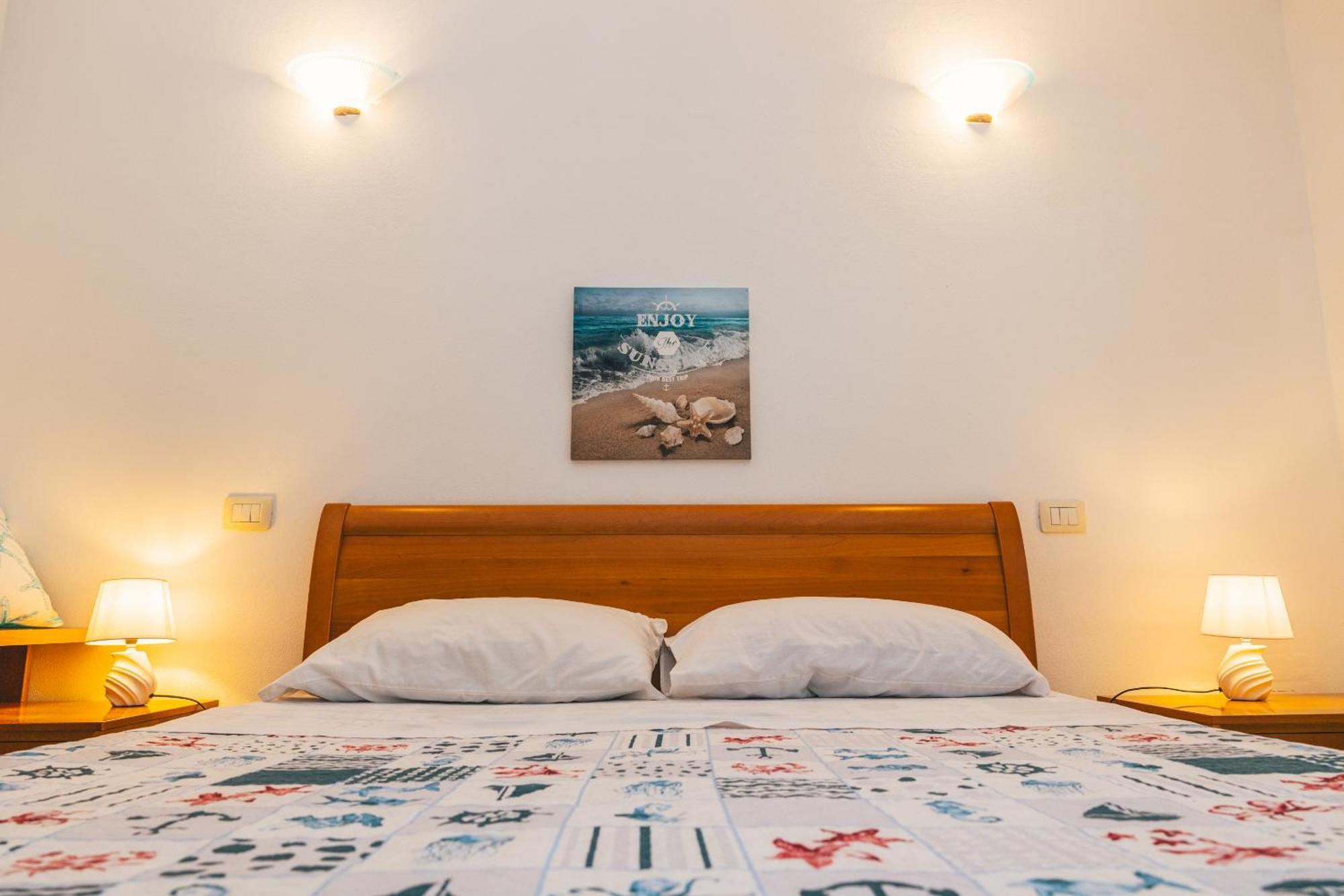 Case Vacanze Il Sogno 2 Porto Pino Pokoj fotografie